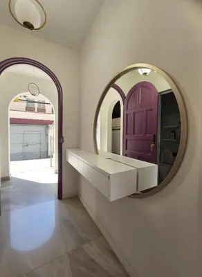 a dressing room with a mirror and a door at E LidiaHome Boutique Room Miraflores Wifi Pro 1B in Lima