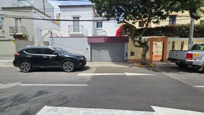 a black car parked in a parking lot at E LidiaHome Boutique Room Miraflores Wifi Pro 1B in Lima