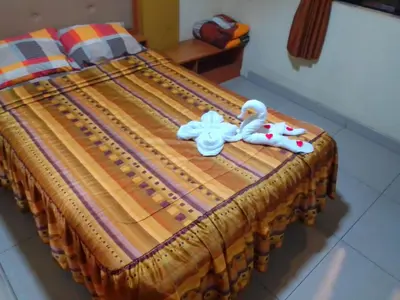 a bed with two stuffed animals on top of it at Hostal Winya in Lima