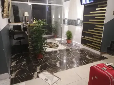 a lobby with a floor with plants on it at Belys inn in Cusco