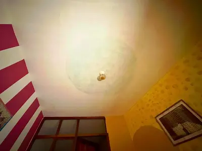 a room with a ceiling with a circle on it at super cute affordable mini apt, san Blas in Cusco