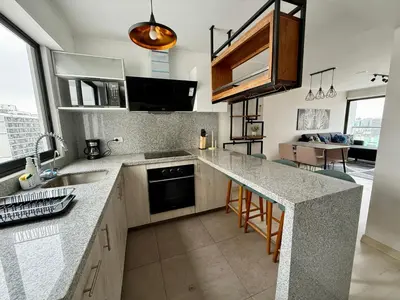 a kitchen with a sink and a counter top at Departamento Vizuale in Lima