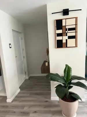 a hallway with a plant in a pot at Modern and Cozy appartment in Lima