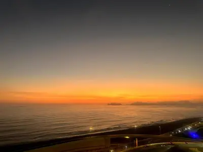 a sunset over the ocean with the horizon at Perfect Balance Rest and Work Study Oceanfront in San Antonio