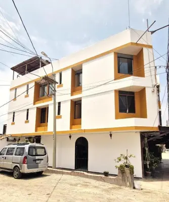 a van parked in front of a building at Los Pulpos in Bombiso