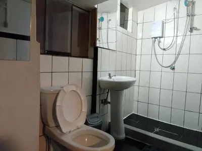 a bathroom with a toilet and a sink at Casa Margarita in Cusco