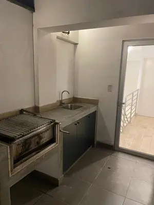 an empty kitchen with a sink and a sink at Lirios 2006 in Lima