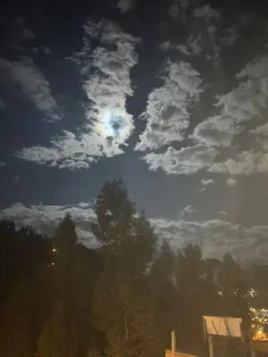 a cloudy sky with the moon in the sky at Xaxa Lodge in Tarma