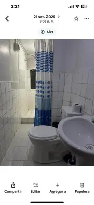 a bathroom with a toilet and a sink at Apartamento Salkantay con vista al Cusco in Cusco