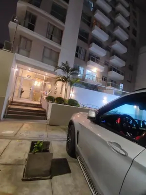 a car parked in front of a building at night at Departamento frente al mar costa verde in Lima