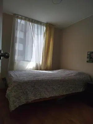 a bedroom with a bed in front of a window at Like a Home - Barranco in Lima