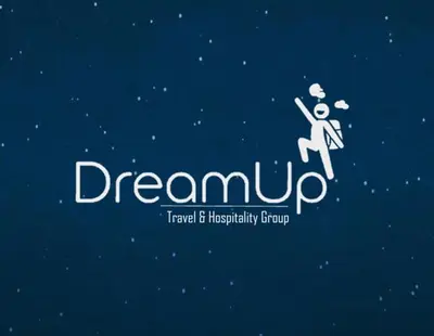 a logo for a dreamciplinary group with a person dancing at Dream Up in Cusco