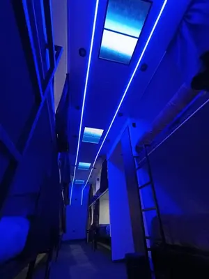 a room with blue lights on the ceiling at Dream Up in Cusco