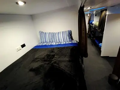 a small bedroom with a bed in a room at Dream Up in Cusco