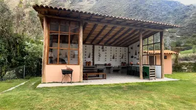 a pavilion with a table in a yard at Urubamba Luxury Stay 
