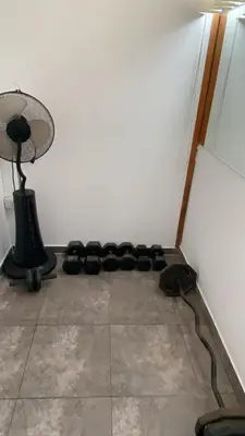 a room with a bunch of black objects on the floor at Duplex penthouse in Miraflores with terrace in Lima