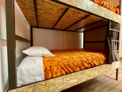 a room with a bed in a loft bed at Hostel - Cusco Dorms in Cusco
