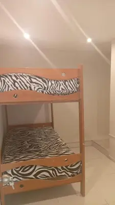 a wooden shelf with a zebra print blanket on it at DEPARTAMENTO AMOBLADO POR TEMPORADA DE PLAYA En PUNTA HERMOSA in Punta Hermosa