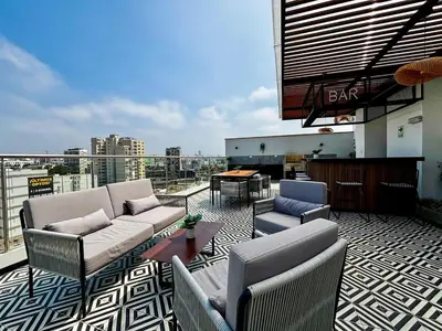 a balcony with couches and a table on a building at New and modern flat in Barranco & Miraflores in Lima