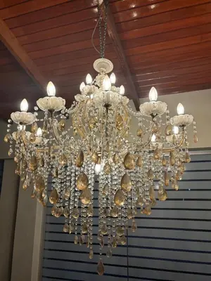 a large chandelier hanging from a ceiling at Villa Luna in Cieneguilla