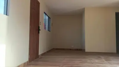 an empty room with a door and a window at Casa Conuca in Ica