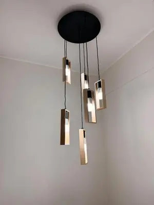 a cluster of lights hanging from a ceiling at Beautiful penthouse in the heart of Miraflores in Lima
