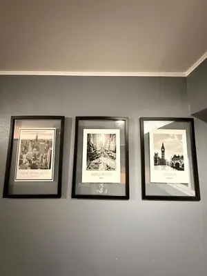 a group of four framed pictures on a wall at Beautiful penthouse in the heart of Miraflores in Lima