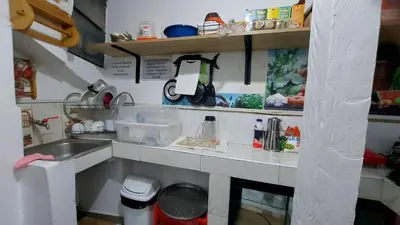 a kitchen with a sink and a counter top at Altos Del Valle in Cusco