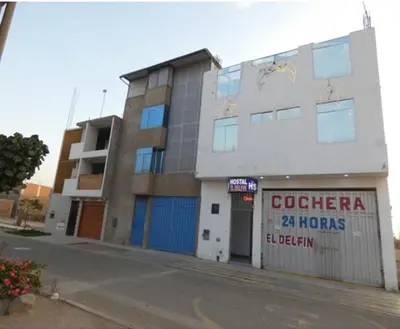 a building on the side of a street at Hotel Lima Norte in Carabayllo