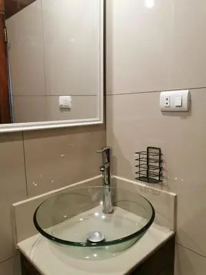 a sink in a bathroom with a mirror at Casa Cota in Lima