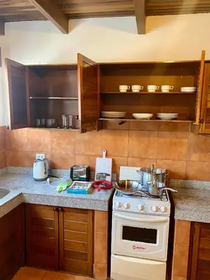 a kitchen with a stove and a counter top at Suite C-1 Wifi 1000 Mbps, recojo gratis aeropuerto in Lima