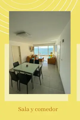 a dining room and living room with a table and chairs at Paracas Exclusivo Departamento familiar in Pisco