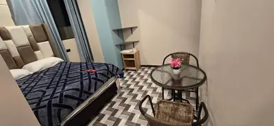 a bedroom with a glass table and a bed at Hotel gym club33 in Huancayo