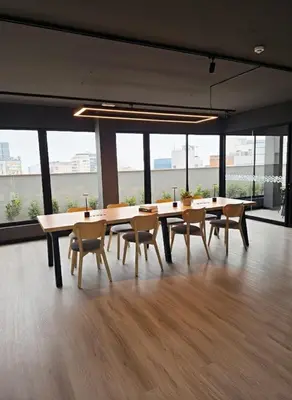 a dining room with tables and chairs in an office at Business Class Suite Miraflores! in Lima