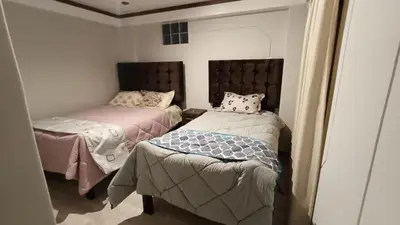 two beds in a room with two beds sidx sidx sidx at Hotel Wasichay - Santa teresa in Santa Teresa