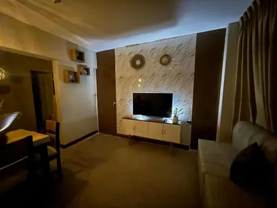 a living room with a flat screen tv on a wall at Apartment in Lima's historic center in Lima