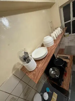 a kitchen with a counter with white plates on it at Apartment in Lima's historic center in Lima