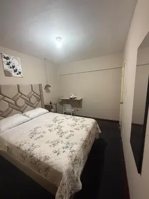 a bedroom with a large bed in a room at Apartment in Lima's historic center in Lima