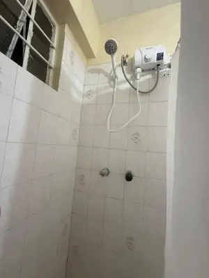 a shower with a blow dryer in a bathroom at Apartment in Lima's historic center in Lima