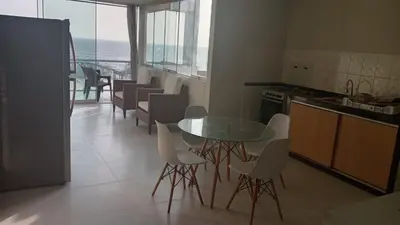 a kitchen with a table and chairs and the ocean at Hermoso Departamento Con Vista Al Mar in Punta Hermosa