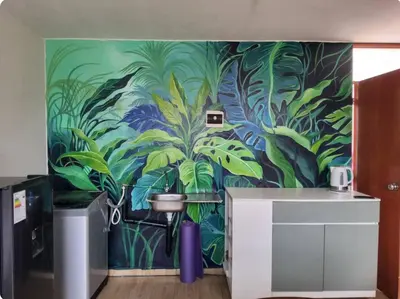 a wall with a mural of a jungle at Casa hogareña Pequeña in Ica