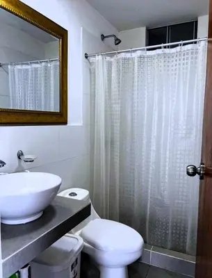 a bathroom with a sink and a toilet and a shower at Paradice a 30 minutos del Boulevar de Asia