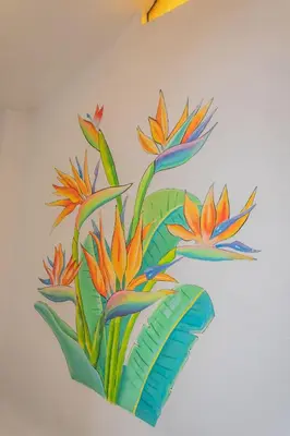 a painting of flowers on a wall at Room A Charming Matrimonial Room in Historic San Blas in Cusco