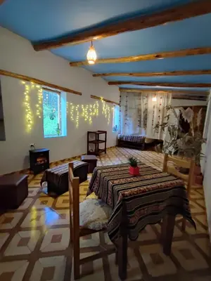 a large living room with two beds and a couch at Loft acogedor in Ollantaytambo
