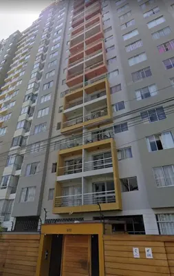 a tall building with balconies on the side of it at Apartamento Ideal en Zona Céntrica in Lima