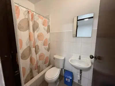 a bathroom with a toilet and a sink at Hostal La Reserva - Pisco in Pisco