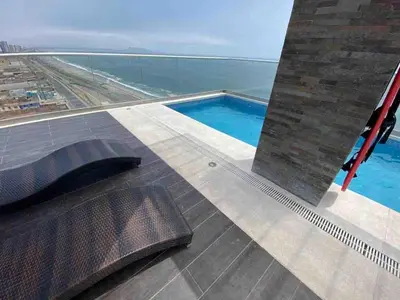 a view of a swimming pool on the roof of a building at COSTANERA Uno in Lima