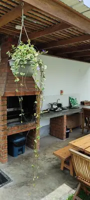 a potted plant is hanging from a patio at Casa Ribera Este in Cieneguilla