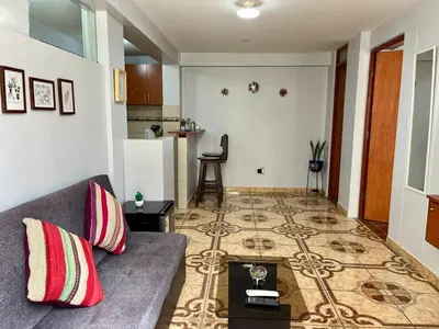 a living room with a couch and a table at Cozy & Centric Apartment in great location! in Cusco