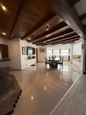 a large living room with a table and chairs at Serendipia City Comfort Suite 901 in Lima